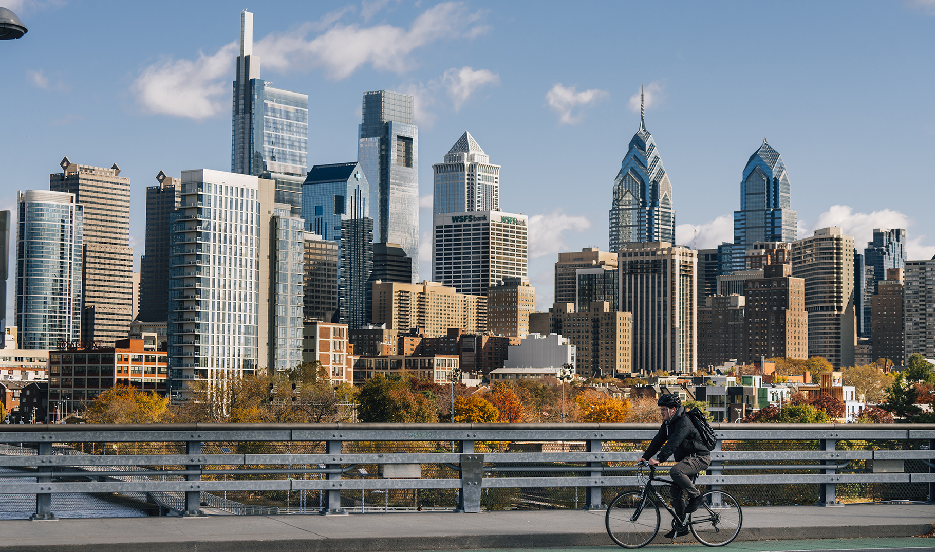A cyclist rides West across the South St. bridge in Philadelphia, Pa., on Nov. 8, 2019.